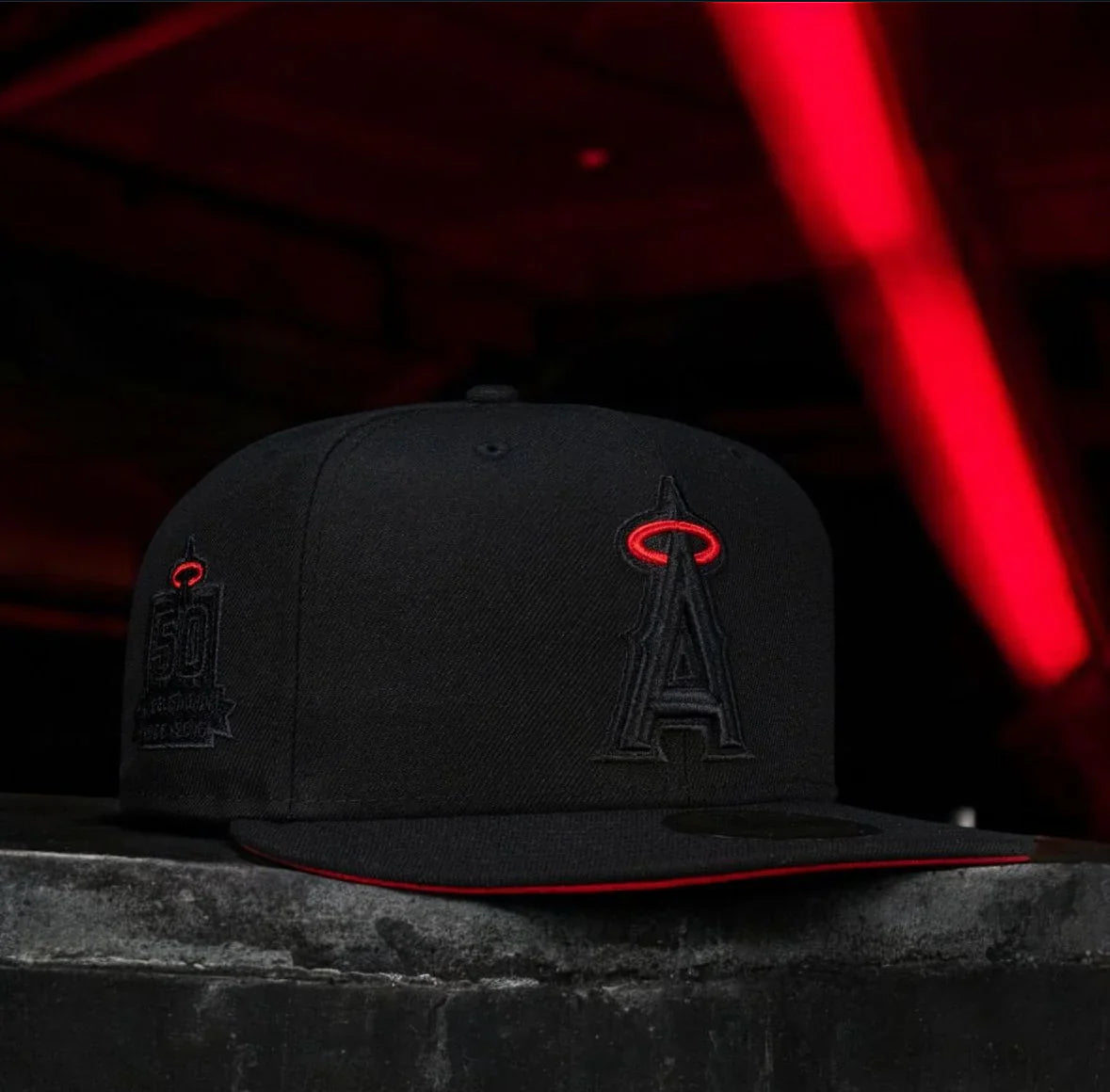 A black fitted hat with the Los Angeles Angels logo in red on the front.