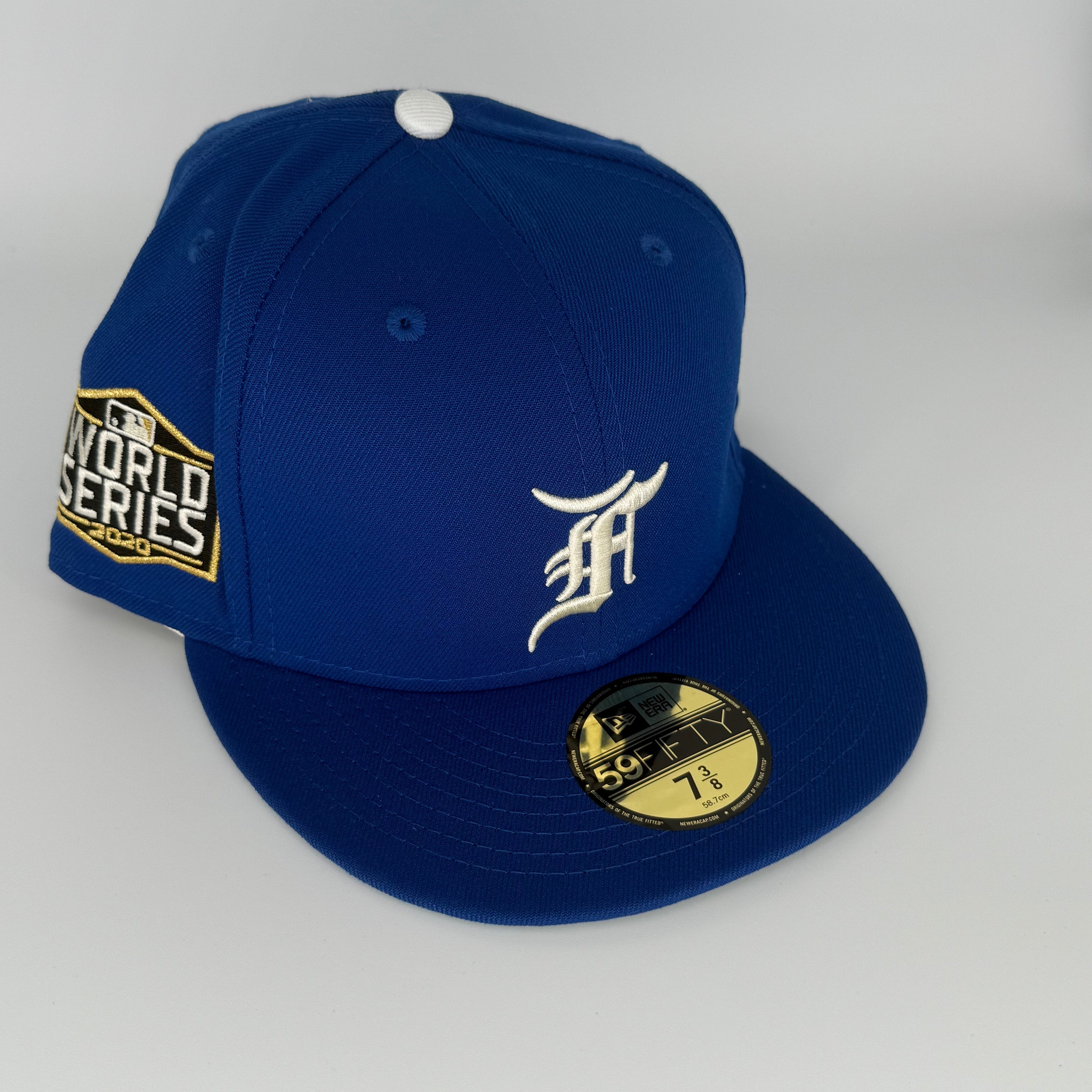 Blue baseball cap with World Series logo and New Era brand on a gray background