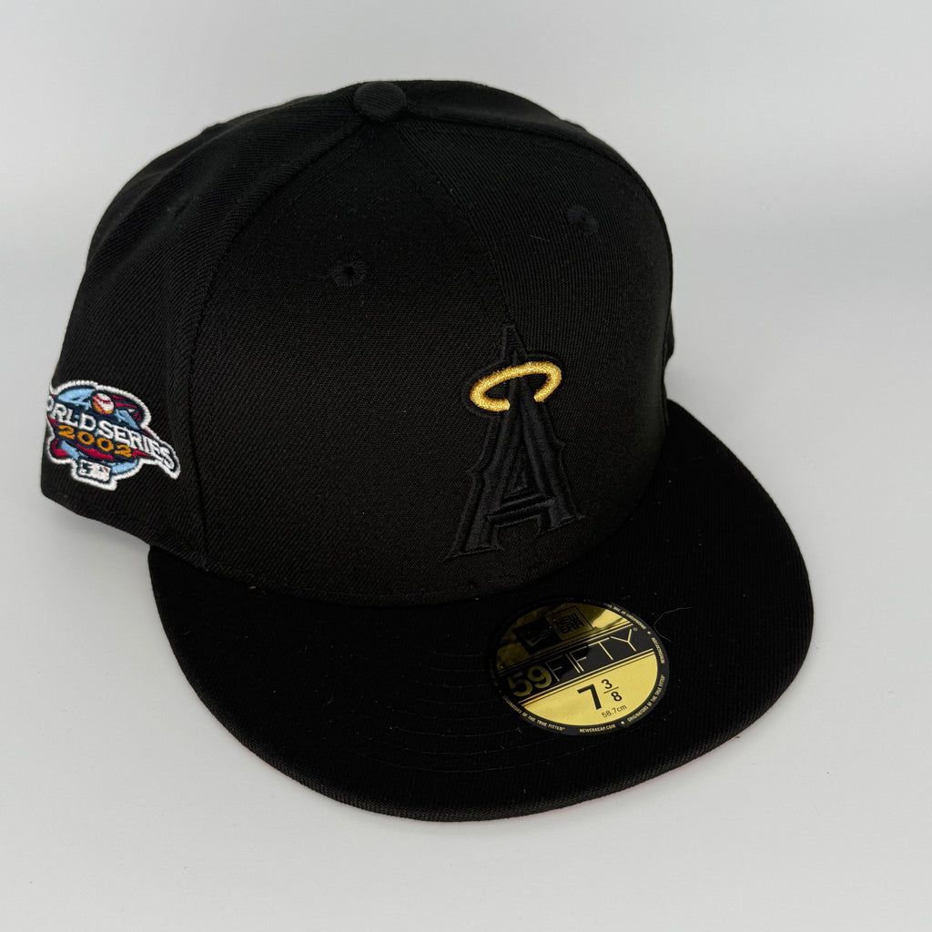 Black baseball cap with logo and World Series patch on a white background