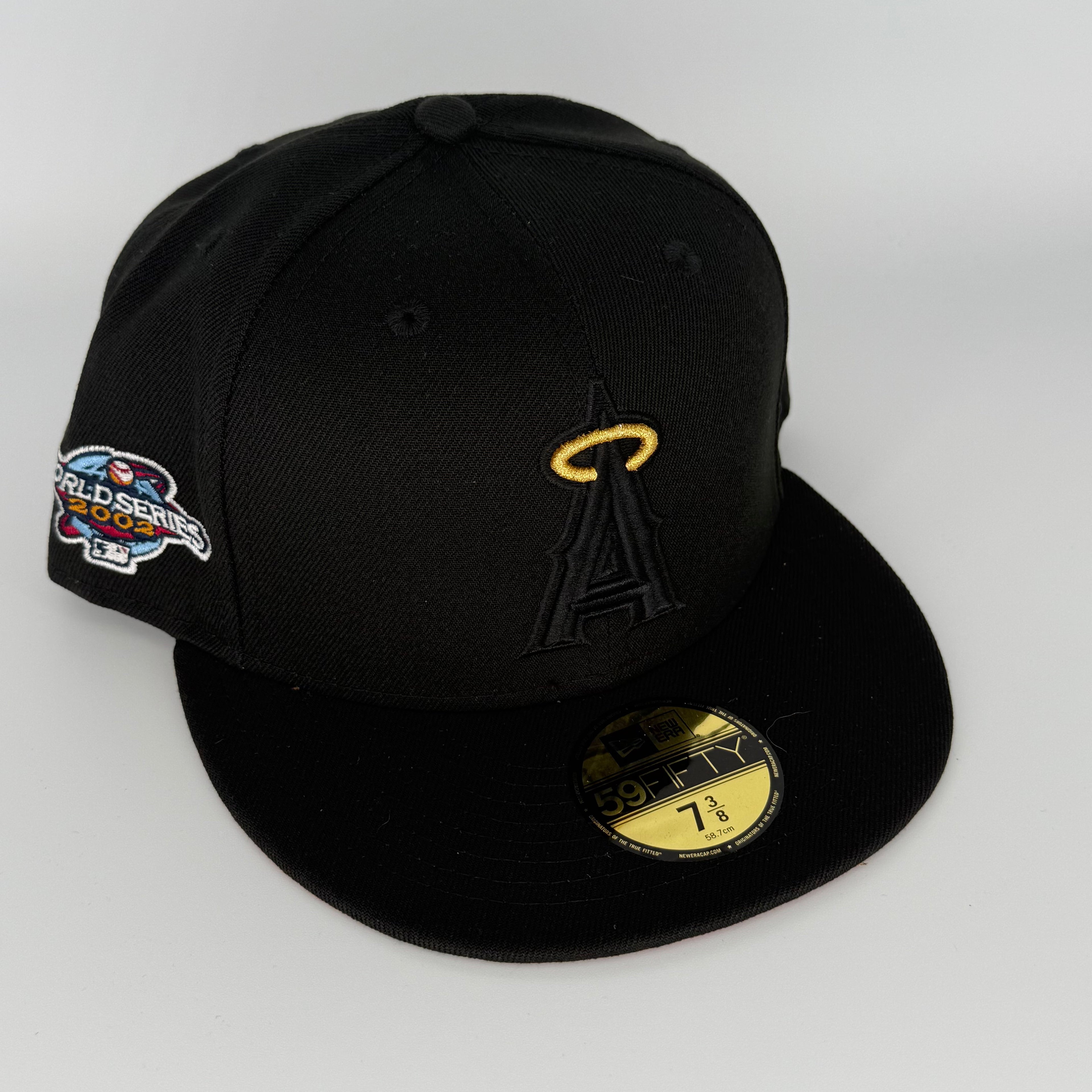 Black baseball cap with logo and World Series patch on a white background